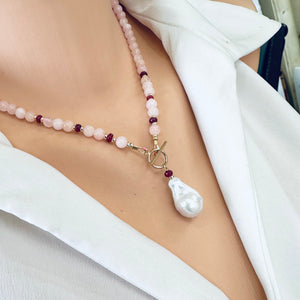 beautiful gemstones toggle necklace combining Soft pink morganite beads with tiny red Ruby rondelles separated with gold filled beads and finished with baroque pearl pendant. 18"inches long