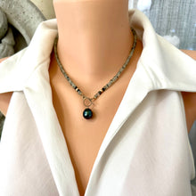 Load image into Gallery viewer, This necklace features a delicate chain of soft, translucent faceted green Prehnite rondelle beads, beautifully complemented by a striking Tahitian baroque pearl as the centerpiece pending from a cold filled toggle clasp. 18&quot;inches long
