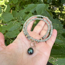 Load image into Gallery viewer, This necklace features a delicate chain of soft, translucent faceted green Prehnite rondelle beads, beautifully complemented by a striking Tahitian baroque pearl as the centerpiece pending from a cold filled toggle clasp. 18&quot;inches long
