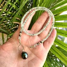 Load image into Gallery viewer, This necklace features a delicate chain of soft, translucent faceted green Prehnite rondelle beads, beautifully complemented by a striking Tahitian baroque pearl as the centerpiece pending from a cold filled toggle clasp. 18&quot;inches long
