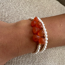 Load image into Gallery viewer, double wrap bracelet, featuring one long strand of lustrous freshwater pearls 4mm accented by stunning deep orange Carnelian Onion briolettes. Gold filled lobster clasp
