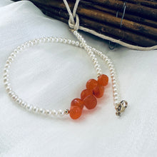 Load image into Gallery viewer, double wrap bracelet, featuring one long strand of lustrous freshwater pearls 4mm accented by stunning deep orange Carnelian Onion briolettes. Gold filled lobster clasp
