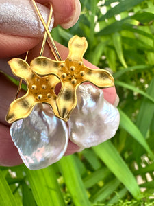 Large Petal pearls dangling gracefully from gold vermeil-plated silver fish hook settings in the shape of flowers, 50mm