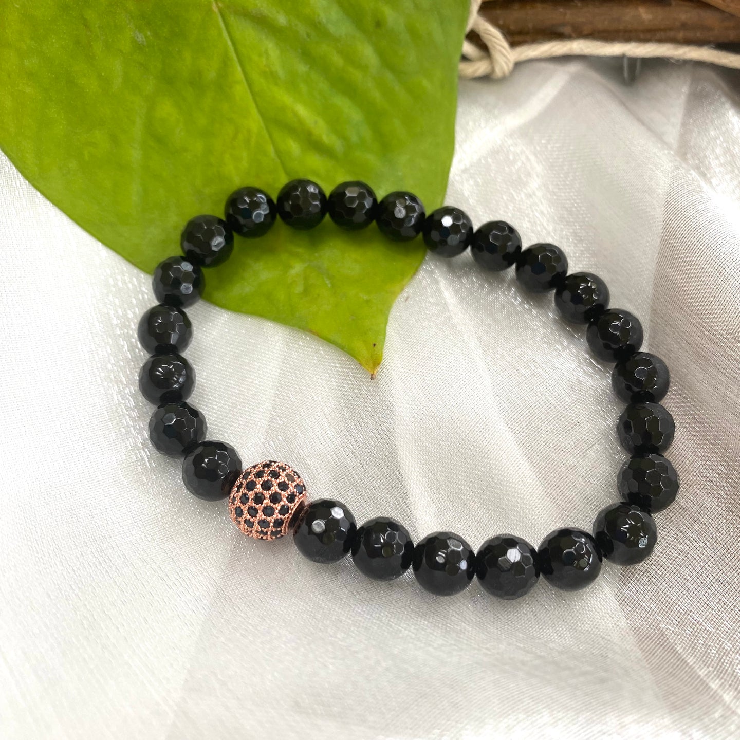 Faceted Black Onyx Stretchy Bracelet For Men with Black Cz Paved Rose Gold Plated Spacer, 7.5