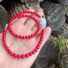 Load image into Gallery viewer, red coral and one large baroque pearl on the side of the necklace with sterling silver details, measuring 18 inches. This vibrant jewelry piece makes a thoughtful gift for her.
