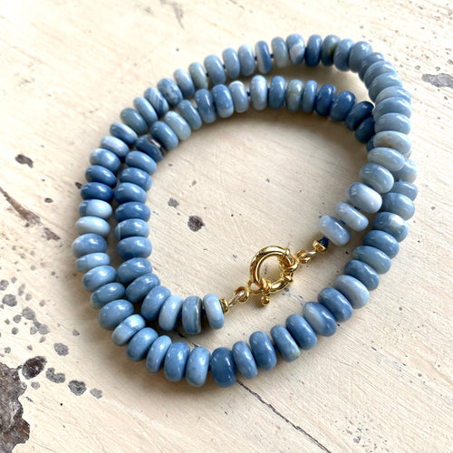 Graduated Oregon blue smooth opal candy necklace 8-11mm with gold vermeil plated sterling silver marine closure, measuring 18 or 19 inches. This modern opal jewelry piece features denim blue tones and is a perfect gift for her.